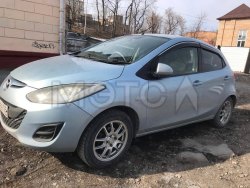 автомобиль марки Mazda Demio