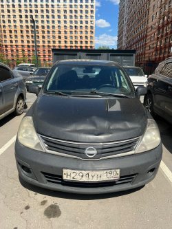Легковой автомобиль марки NISSAN TIIDA, VIN № 3N1FCAC11UK566542, 2012 года выпуска, цвет черный.